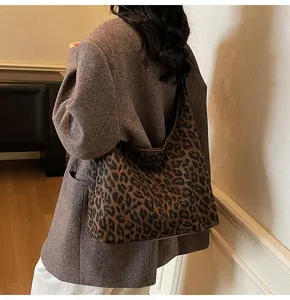 Close-up of leopard print shoulder bag with detailed texture and large capacity design