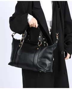 Black litchi grain leather tote bag with gold hardware and removable shoulder strap