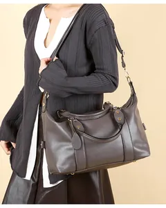 Deep gray lychee pattern leather tote bag with gold hardware and removable shoulder strap