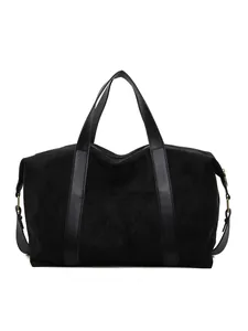 Minimalist black suede tote bag with durable faux leather straps for business travel