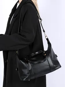 Elegant black litchi pattern leather tote bag with dual handles and adjustable strap