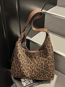 Minimalist large leopard print hobo bag with adjustable brown leather shoulder strap