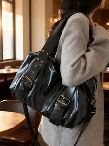 Maillard punk motorcycle tote bag in black faux leather with bronze buckles and studs