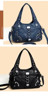 Dettaglio di borse hobo vintage con cerniere multiple e ciondoli a forma di petalo