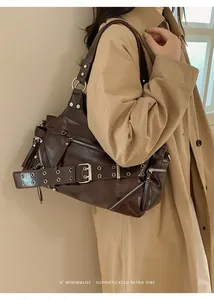 Detailed side view of deep brown vintage faux leather shoulder bag with metal hardware