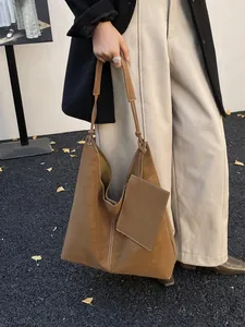 Brown leather large tote bag with contrast stitching and small pouch in Korean style