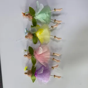 Detail view of handmade Easter fairy pendants with colorful tulle skirts and wings
