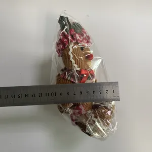 Detailed measurement showing 12cm width of plush Gingerbread Man Christmas ornament
