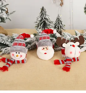 Detailed view of plush Santa Claus, Snowman and Reindeer holiday curtain tiebacks
