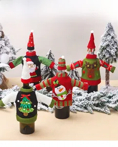 Detail showing four styles of knitted Christmas wine bottle covers with holiday patterns