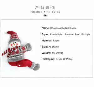 Detail of fabric snowman curtain buckle with knitted hat for Christmas window decoration
