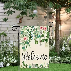 Bandiera di benvenuto da giardino con design floreale e supporto su staccionata bianca