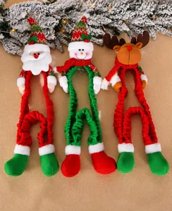 Detail view of festive Christmas long-legged plush ornaments with Santa, Snowman and Reindeer