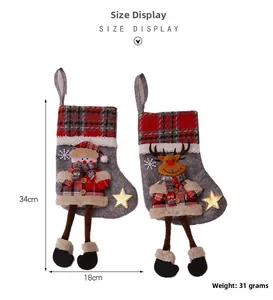 Detail view of 34cm Christmas stockings with 3D snowman and reindeer plush characters