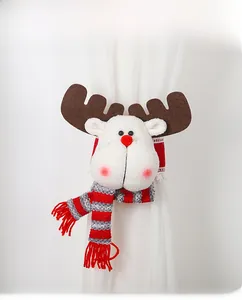 Detail of Christmas reindeer plush curtain buckle with striped scarf and soft white fur