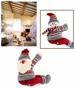 Detail of plush Santa and Snowman curtain tiebacks with knit scarves and plaid details