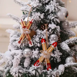 Christmas wooden ski hanging ornament with white plush decor on a snow-covered tree