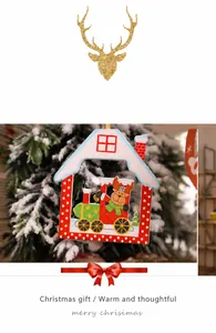 Close-up of wooden Christmas tree ornament featuring a reindeer driving a colorful toy train