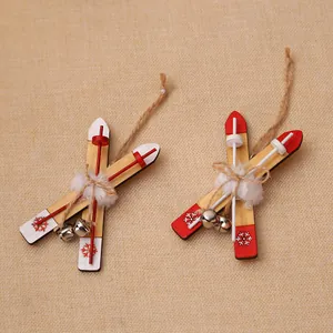 Miniature wooden sled ski ornament with red snowflake pattern and rustic rope for Christmas