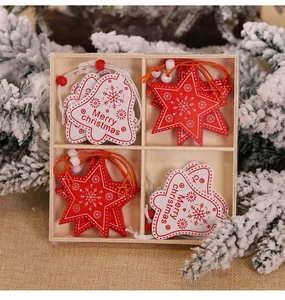Close-up of wooden Christmas tree ornaments with red stars and bells in a divided wooden tray
