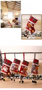 Detail of Christmas stocking featuring 3D Santa and reindeer with snowflake embroidery