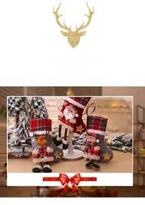 Detailed view of plush reindeer, Santa and snowman Christmas stockings with plaid cuffs