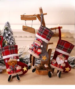 Detailed view of Christmas stockings featuring 3D Santa, Snowman and Bear characters