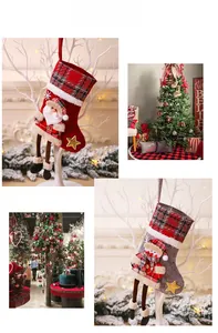 Close-up of 3D Santa and snowman Christmas stockings with plaid cuffs and star embroidery