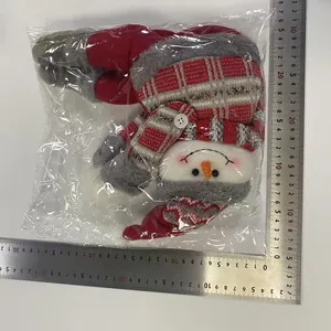 Close-up of plush Christmas snowman curtain buckle with dimensions shown by measuring ruler