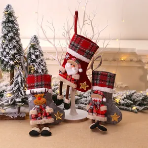 Set of 3 Christmas stockings with 3D Santa, Reindeer and Snowman on a cozy fireplace