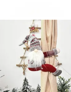 Detail of a Christmas gnome curtain tieback with red knitted hat and white beard