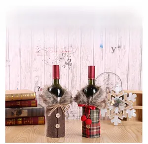 Detail of Christmas wine bottle covers featuring plaid fabric and faux fur collars