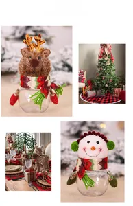 Detailed view of Christmas candy jars with reindeer and snowman plush toppers for decor