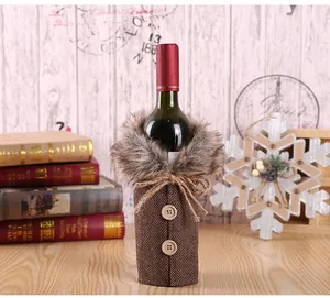 Detail of Christmas wine bottle cover with brown herringbone fabric and faux fur collar