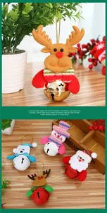 Detail of plush Christmas ornaments with Santa, elk, and bear hanging on star bells