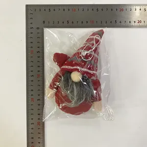 Detailed view of plush Christmas gnome ornaments with scale showing dimensions