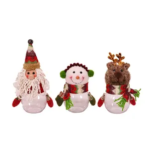 Three Christmas themed transparent candy jars featuring Santa Claus, Snowman and Reindeer
