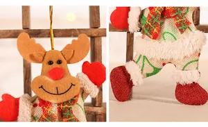 Detail of a Christmas reindeer plush ornament with burlap body and red plaid scarf