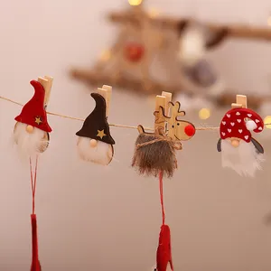 Set of four wooden Christmas clips featuring gnomes and reindeer on hemp rope