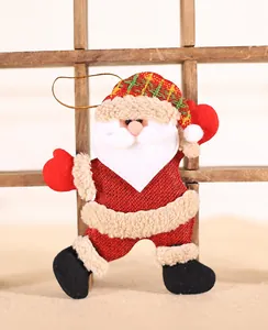 Detail of Santa Claus burlap ornament with red plaid hat and gold hanging string