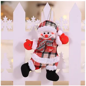 Detailed plush snowman Christmas ornament with red plaid fabric and golden hanging string