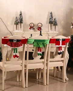Detailed Christmas elf and Santa belt chair covers shown in a festive home setting