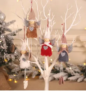 Detail of four colorful plush angel dolls with glittery wings for Christmas tree decor