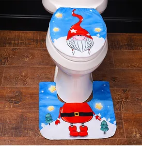 Detail of soft plush Christmas gnome toilet cover and U-shaped rug set for bathroom decor