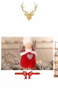 Detail of red plush Christmas angel doll with silver wings and sequin heart ornament