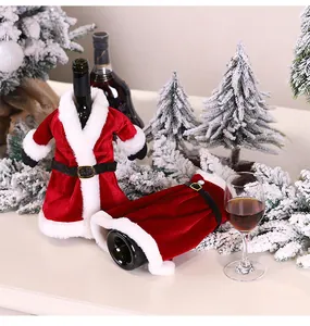 Detail of red velvet Christmas wine bottle covers with white fur trim and black belt buckle