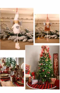 Detailed Christmas scene display with plush angel dolls and festive reindeer ornaments