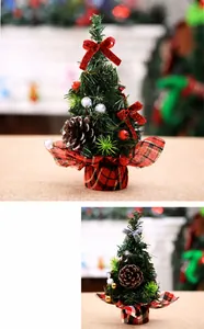 Detail of 20cm mini Christmas tree with red bows, pine cones and red plaid fabric base