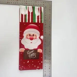 Detailed view of Santa wine bottle bag showing 36cm length dimensions on white background