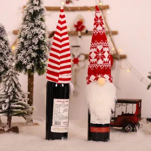 Christmas gnome wine bottle covers with knitted hats and white fur beards for table decor